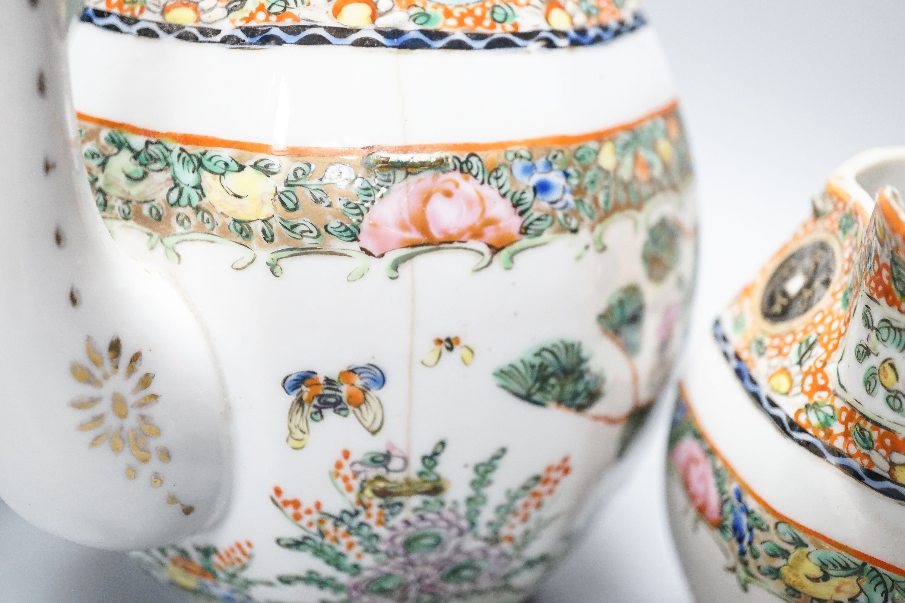 A Chinese celadon glazed vase, 24cm and a Chinese famille rose teapot and matching cream jug, a.f.